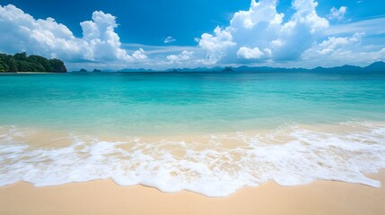 A tropical beach with soft white sand and clear turquoise water beneath a blue sky