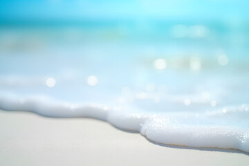 background with sparkling white sand and blue blurred sea