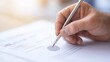 © Tondone - Close-up of a hand signing a document with a pen. Focus on the signature and paper, illustrating concepts of agreement and business.