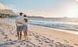 © peopleimages.com - Hug, walking and back of couple on at beach for love on vacation, anniversary and holiday. Footprints, sand and people at ocean for bonding together for trip adventure on tropical island in Spain