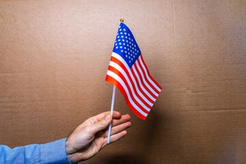 The red, blue and white flag of USA is a symbol of the country's independence, representing the patriotic spirit of the Americans nation and its government