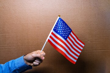 Wall Mural - The red, blue and white flag of USA is a symbol of the country's independence, representing the patriotic spirit of the Americans nation and its government