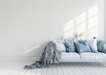 A white sofa with blue pillows and a gray blanket in a minimalist living room with white walls and wooden floors