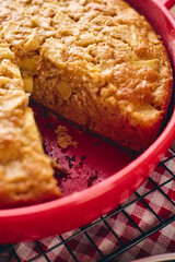 Poster - Autumn apple biscuit pie type charlotte in a red baking pan