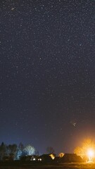 Wall Mural - Real Night Sky Stars Above Old Village. Natural Starry Sky Above Rural Countryside Landscape In Belarus