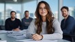 © Marina Varnava - Confident woman leads a professional group discussion in a bright office