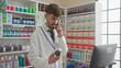 © Krakenimages.com - Hispanic pharmacist man consulting on phone in drugstore