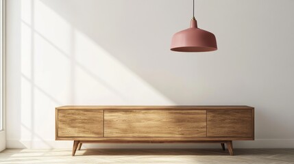 Poster - Retro pink ceiling lamp hanging above a wooden sideboard in a contemporary living room with an empty white wall offering space for your sofa