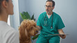© Krakenimages.com - Hispanic veterinarian consults with woman about her poodle in a clinic room.