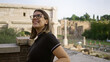 © Krakenimages.com - Young woman enjoying the scenic view at the historic roman forum in rome, italy, capturing a moment of cultural exploration and travel in europe.