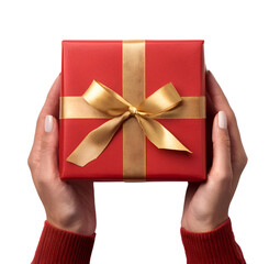 woman hand holding red gift box with golden ribbon