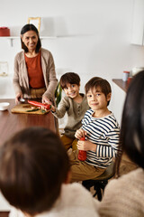 A cheerful Asian family gathers in a modern kitchen, preparing festive treats for the holiday season.