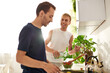 © Bliss - In a bright kitchen, a gay couple happily prepares a lunch and enjoying their time together.
