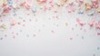 © Netthida Arsa - Light pastel confetti and sparkles scattered on a clean white background create a magical, cheerful effect with plenty of space for text