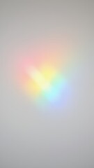 Poster - A blurred rainbow reflection against a gray background.