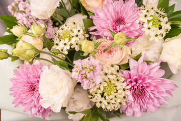 Wall Mural - Bouquet of flowers with pink roses, chrysanthemum and freesia flower in a vase isolated on a white background.