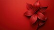 © NAPATT - Detailed red paper flower on a solid red background, creating a dramatic and elegant composition
