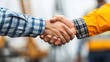 © marco - Two people shaking hands, a gesture of agreement and partnership.