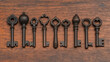© Kingdola - Antique Keys on Wooden Surface: A collection of vintage keys, each with its own unique design, rests on a rustic wooden surface. The keys evoke a sense of history and mystery.