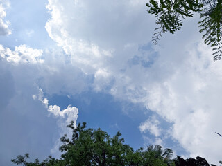 Big clouds floating in the sky Forming together into rain clouds in the afternoon