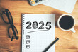 © ARAMYAN - New year resolutions 2025 on desk. 2025 goals list