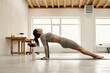 © TrueFrame Collective - Executing Yoga Pose in Bright Spacious Room