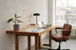 © Clique Images - Modern Workspace with Wooden Desk and Office Chair
