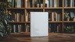 © Gita - Blank book mockup standing on a rustic wooden table against a backdrop of bookshelves and plants, providing ample copy space for design presentations.