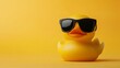 © Resad - Copy space on the right, cute small yellow rubber duck with black sunglasses. The idea is 'be smart, be cool.'