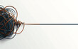 © BARETH - raffled wire a tangled rope or cord slowly untangles colorful string in plain white background copy space for text confusing resolving clearance of mind
