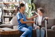 © InsideCreativeHouse - Middle-aged caregiver nurse doctor medical worker taking care of elderly senior patient, listening to complaints and diagnosis. Visiting lonely grandmother in hospice private clinic.