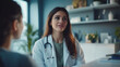© Inspire Shots Hub - A female doctor listens intently to a patient in her office