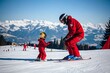 © JBMotillon - Moniteur de ski en tenue rouge donnant un cours à un jeune enfant