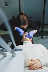 Braces on the teeth. Female jaw without one tooth. Installation of braces on the teeth.