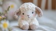© bersch28 - Adorable crochet lamb featuring soft, fluffy texture and cute floppy ears. This hand-made plush toy adds charm and warmth to any collection or nursery decor.