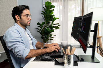 Smart IT developer working software development coding with creating application program update version online website on data's company system two computer code pc screen at modern office. Surmise.