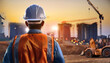 © Cascade Image Studio - Male civil engineer stands looking at the construction site