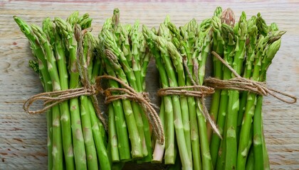 Wall Mural - Fresh green asparagus bundles