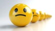 © Pasha - yellow smileys stand in a row on a white background