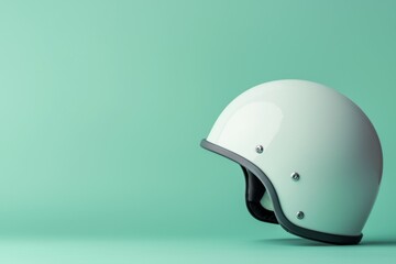 Wall Mural - A white motorcycle helmet is sitting on a green background