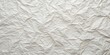 © Theerawat - Wrinkled White Paper Texture A Close-Up Shot Of Creased Paper With Irregular Patterns And Subtle Shadows