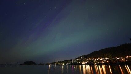 Wall Mural - Northern Lights dancing above Nanaimo, Vancouver Island. Timelapse.