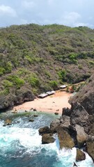 Wall Mural - A white sand beach between the beauty green hill