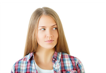 Wall Mural - Woman with long hair in a plaid shirt looks to the side, isolated on a white background. Concept of contemplation and casual style