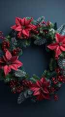 Wall Mural - A wreath with red poinsettias and berries is displayed on a blue background. The wreath is circular and has a festive, holiday feel to it