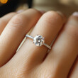 © rattana - Close up of an elegant engagement diamond ring on woman finger