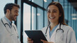 © Shahazadi - Healthcare professionals sharing a joyful moment in a modern hospital setting