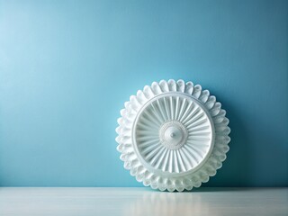 Wall Mural - Elegant white European glass rosette against a minimalist blue wall creates a striking decorative accent for contemporary interiors and chic home decor.