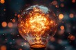 © Lubos Chlubny - Bright lightbulb shining with orange sparks and bokeh effect