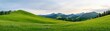 © lnwAI - Breathtaking panoramic view of lush green hills under a cloudy sky, showcasing the beauty of nature and serene landscapes.